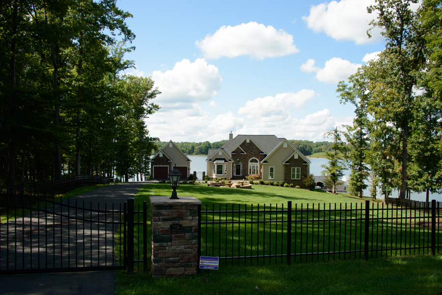 A Spartan-built home on a wooded lakefront lot at Lake Anna with the water behind it